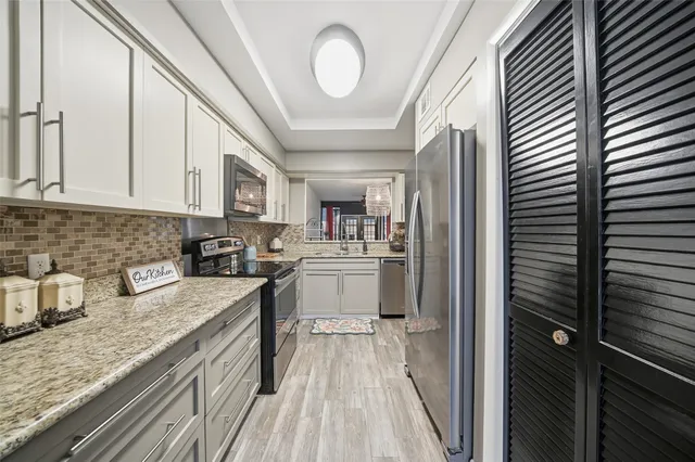 a view of front door and wooden floor