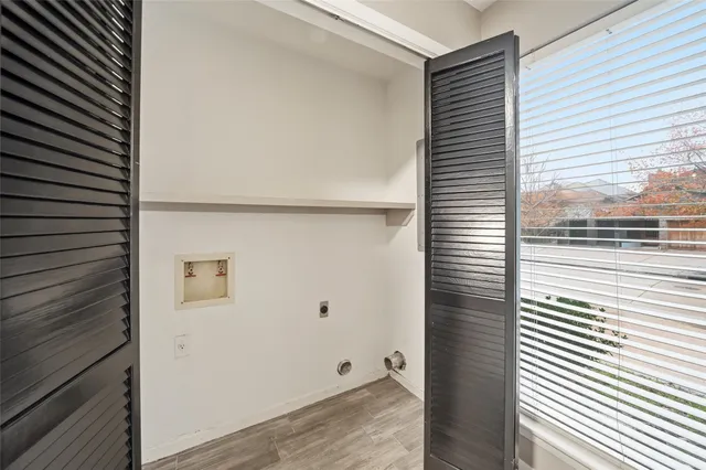 a bathroom with a double vanity sink toilet and mirror