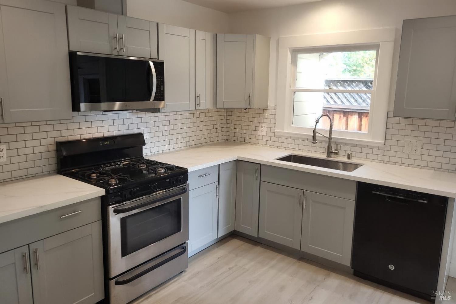 829 Hunt Avenue, Unit A St. Helena, CA 94574 - Photo 4 of 13 a kitchen with stainless steel appliances a stove a sink a microwave and cabinets
