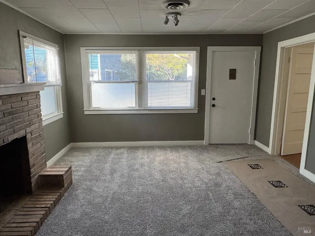 a view of an empty room with a window