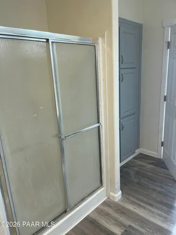 a view of empty room with window and ceiling fan