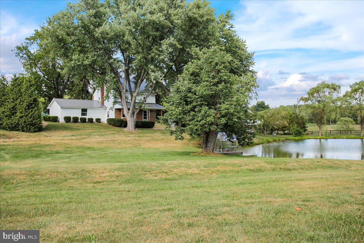 233 Hetrick Road Bernville, PA 19506 - Photo 2 of 29 a swimming pool that has lawn chairs and a big yard