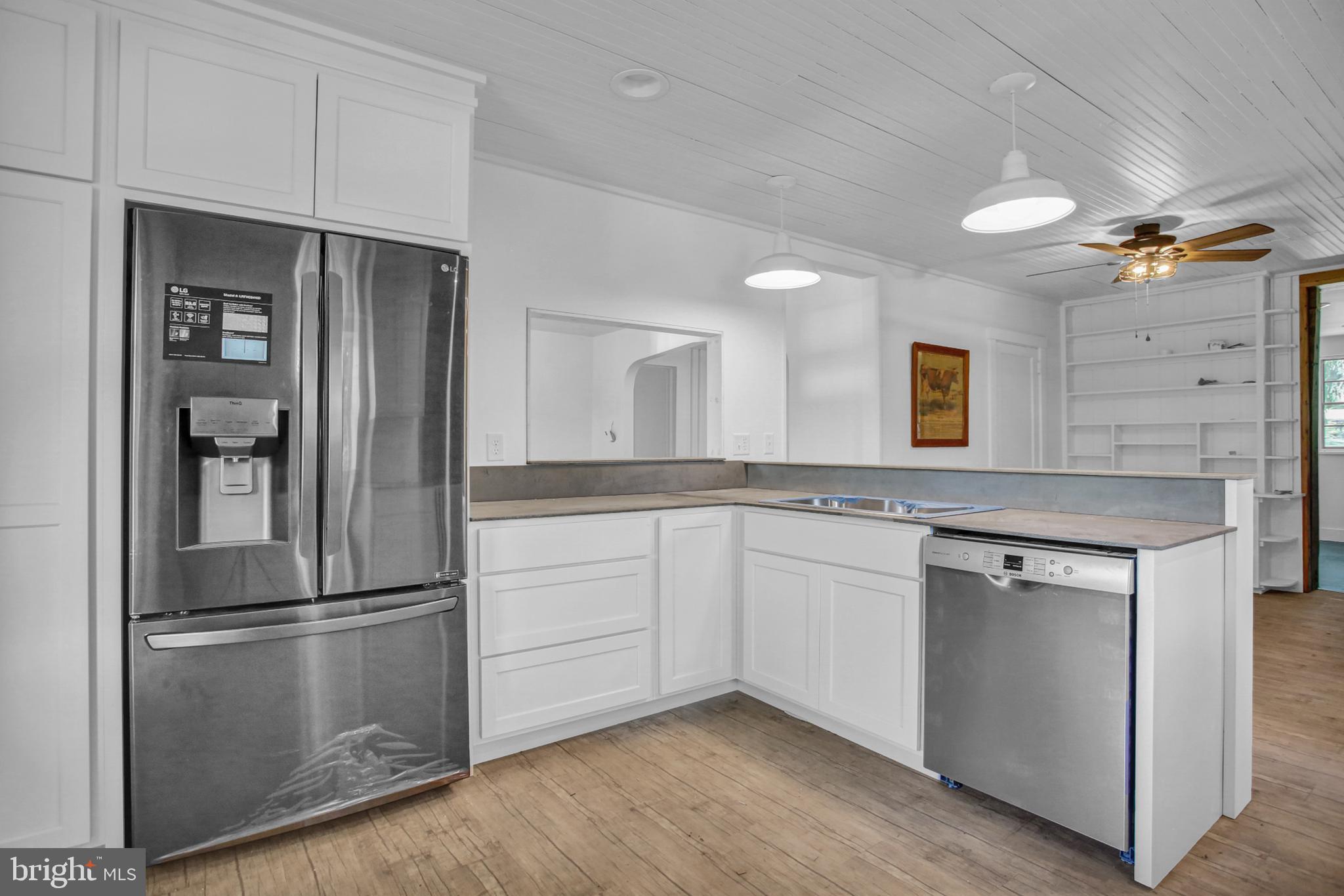 233 Hetrick Road Bernville, PA 19506 - Photo 6 of 29 a kitchen with stainless steel appliances granite countertop a refrigerator and a stove