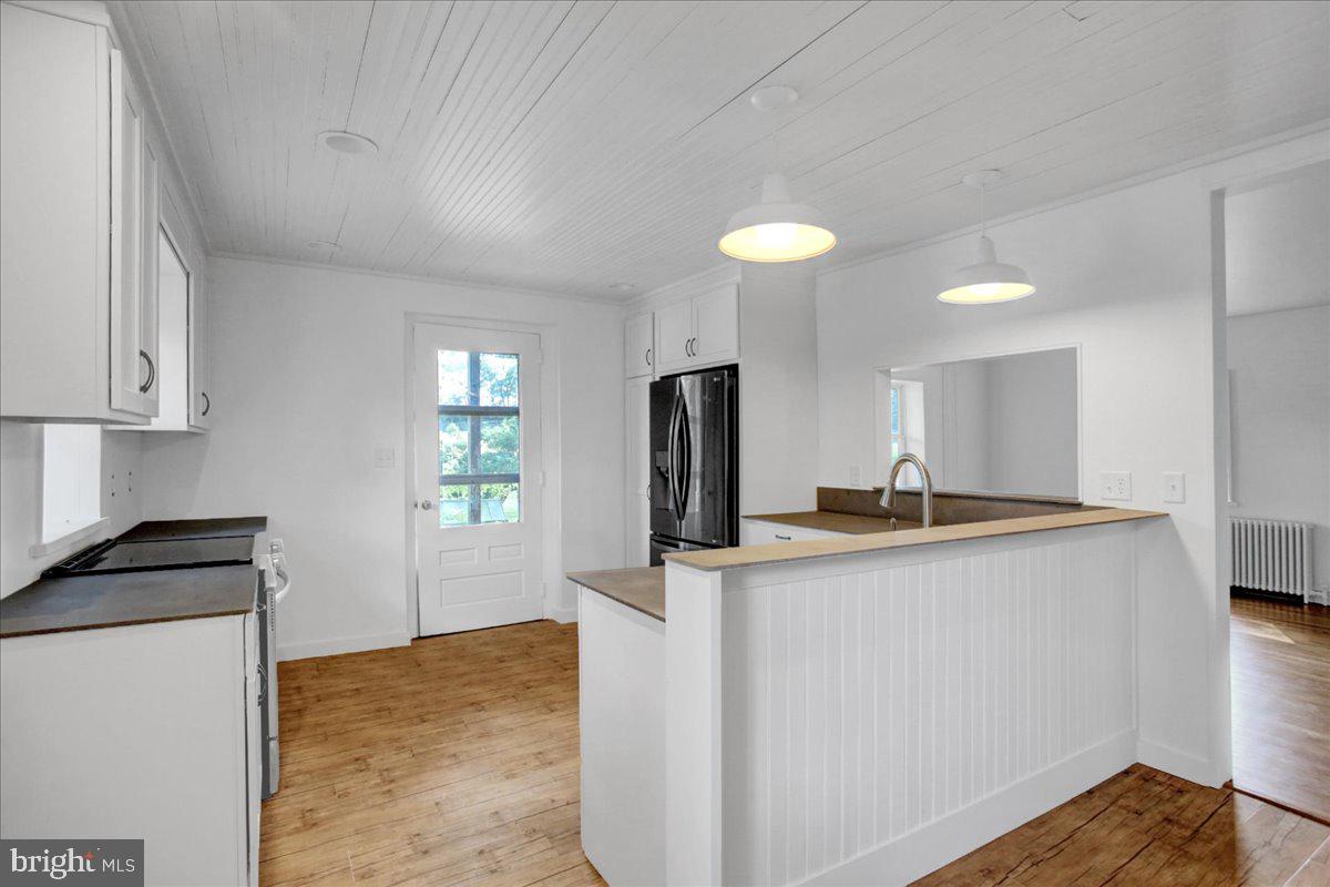 233 Hetrick Road Bernville, PA 19506 - Photo 10 of 29 a kitchen with stainless steel appliances granite countertop a sink stove and refrigerator