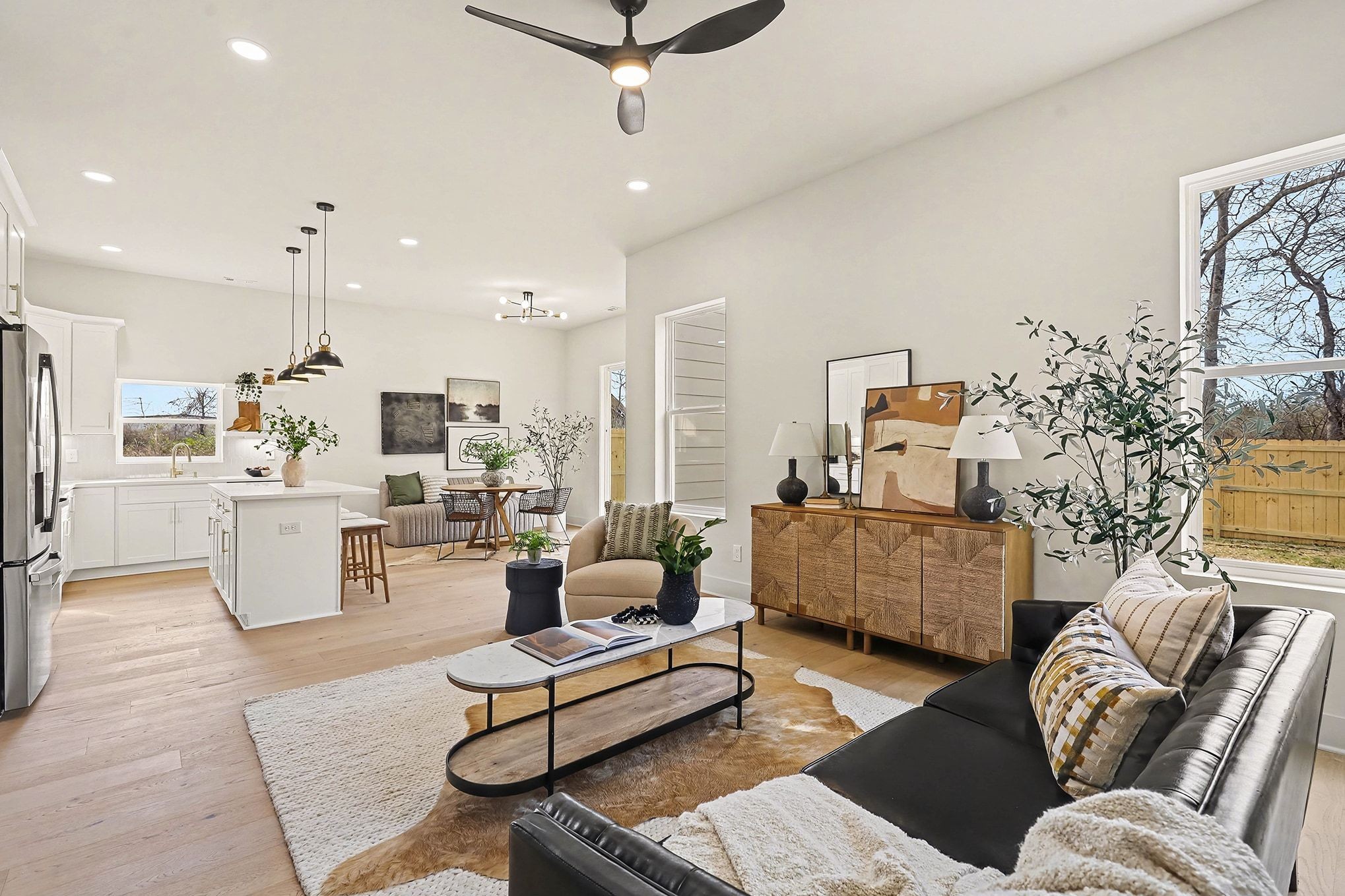 3411 Hydes Ferry Road Nashville, TN 37218 - Photo 4 of 23 a living room with furniture kitchen view and a chandelier