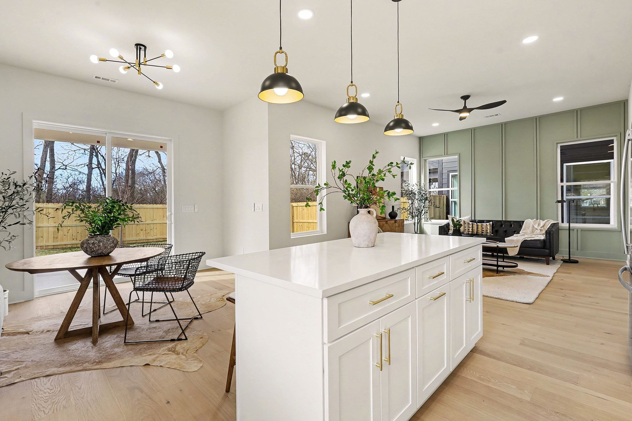 3411 Hydes Ferry Road Nashville, TN 37218 - Photo 8 of 23 a view of a dining room and livingroom with furniture wooden floor a chandelier