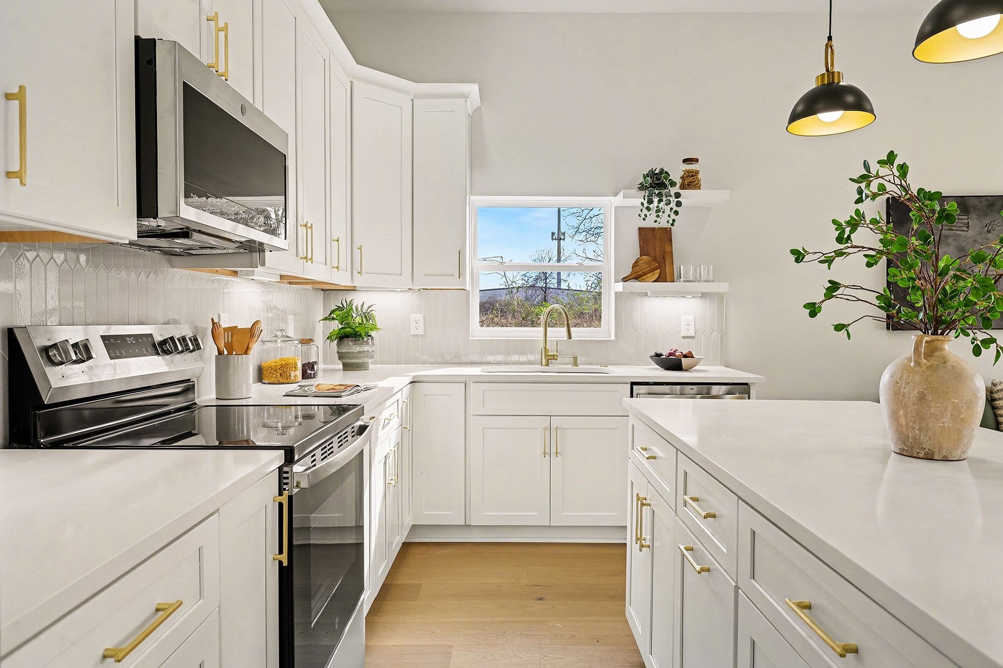 3411 Hydes Ferry Road Nashville, TN 37218 - Photo 9 of 23 a kitchen with a sink stove and microwave