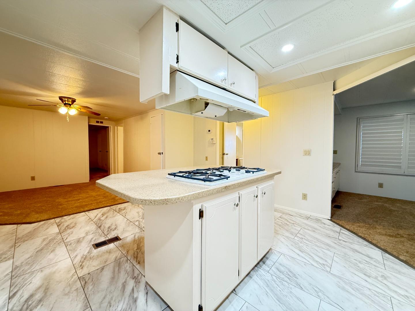224 Queens Way, Unit 224 Pittsburg, CA 94565 - Photo 19 of 33 a kitchen with a stove and a refrigerator