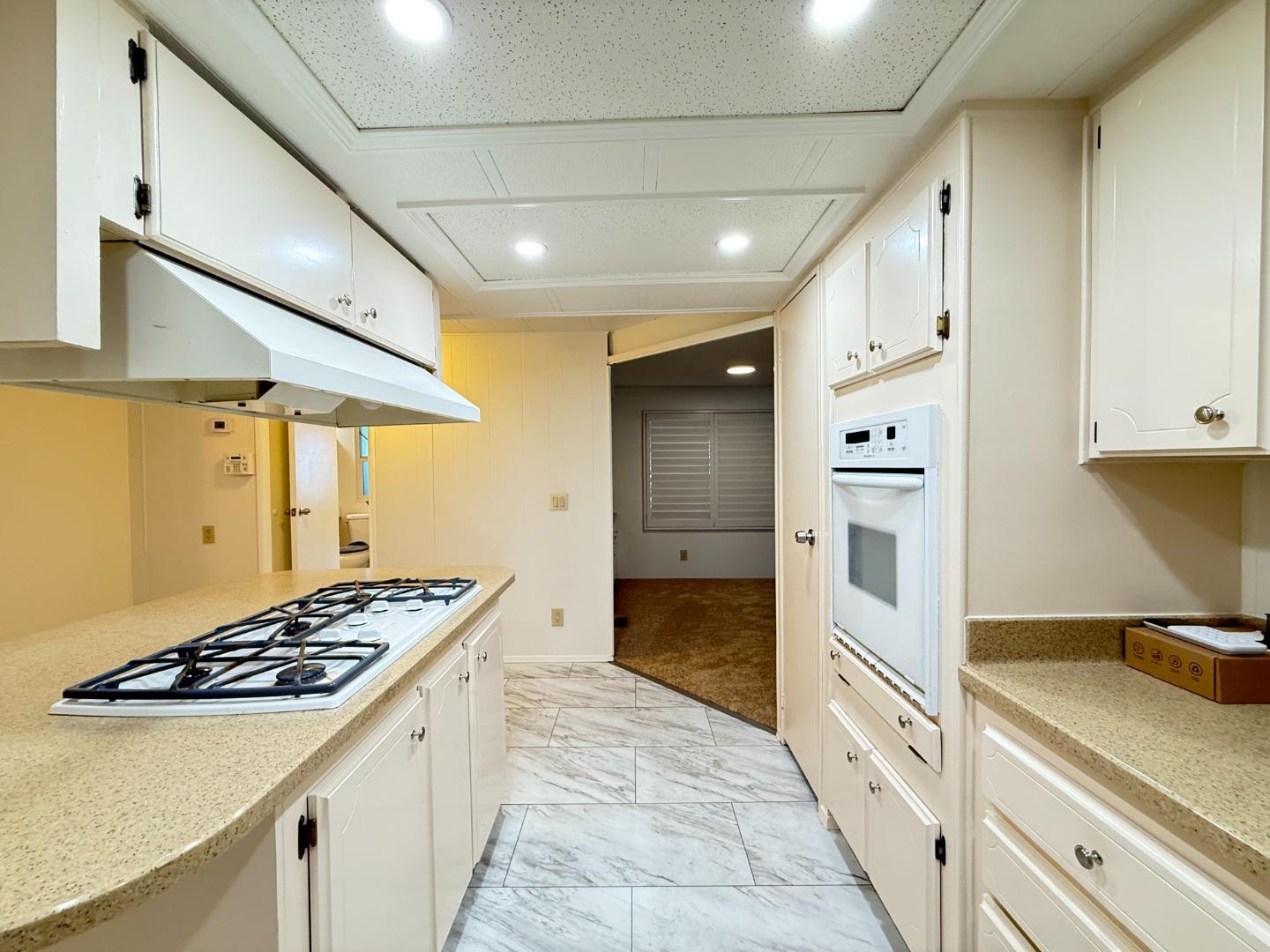 224 Queens Way, Unit 224 Pittsburg, CA 94565 - Photo 20 of 33 a kitchen with stainless steel appliances a stove a sink and a refrigerator