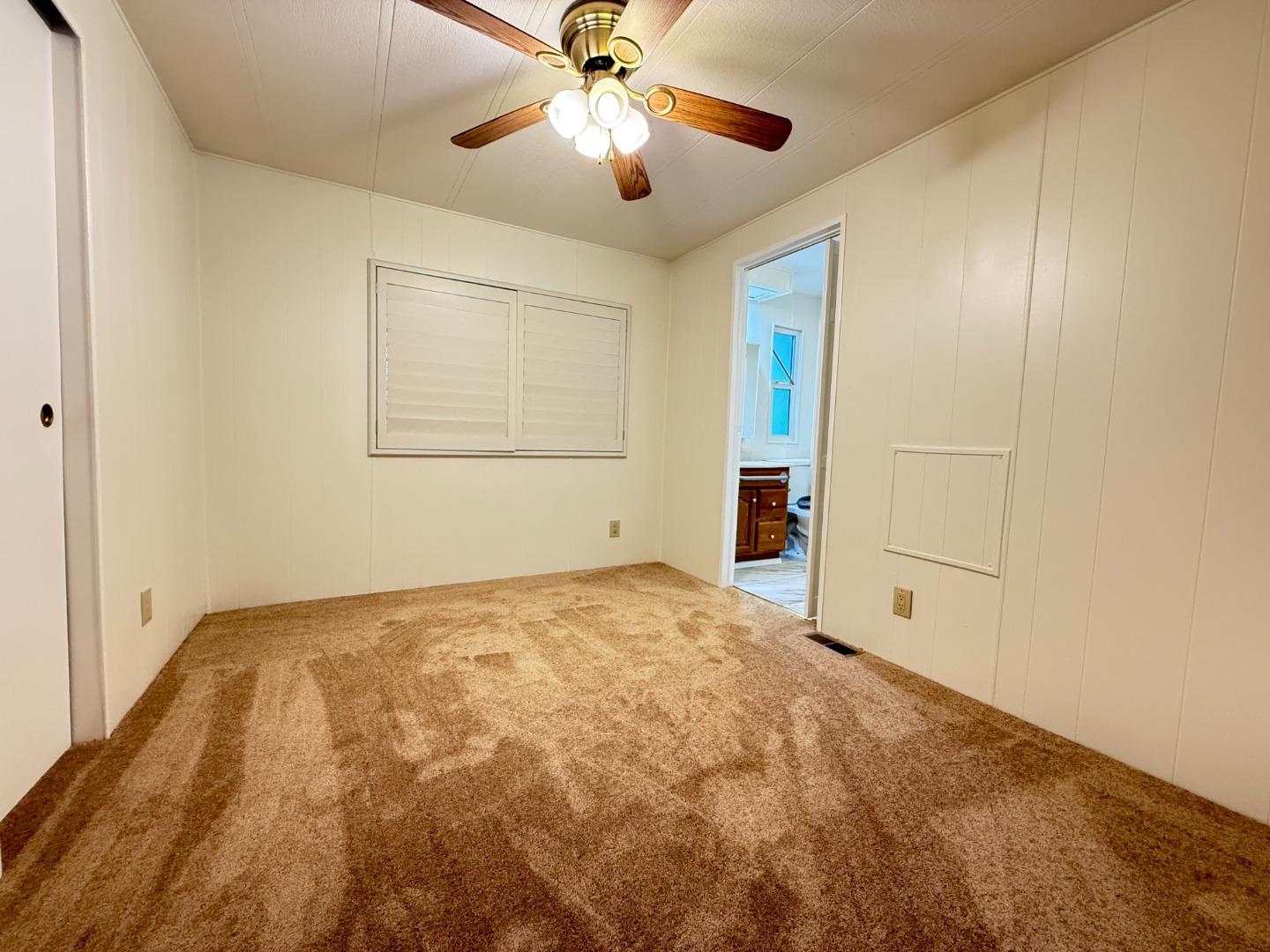 224 Queens Way, Unit 224 Pittsburg, CA 94565 - Photo 26 of 33 a view of an empty room with a ceiling fan