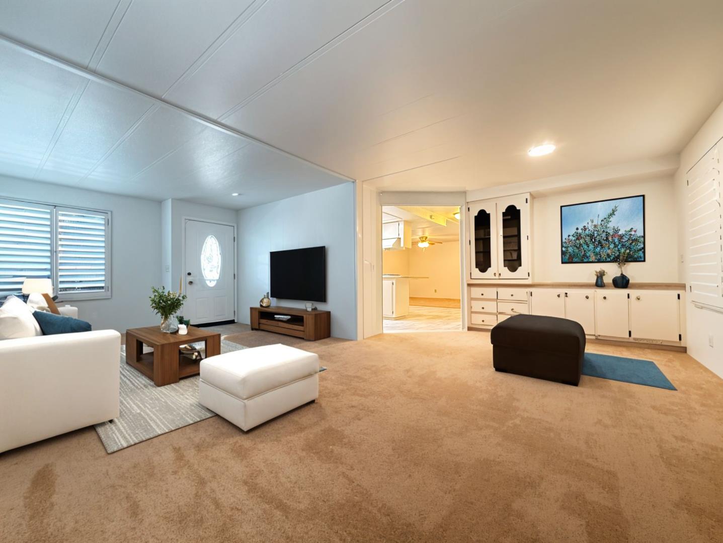 224 Queens Way, Unit 224 Pittsburg, CA 94565 - Photo 3 of 33 a living room with furniture and a flat screen tv