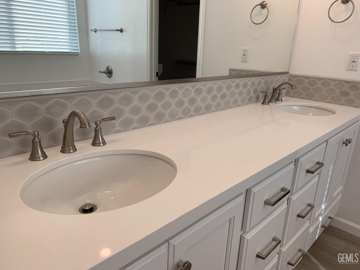 Undisclosed Address Bakersfield, CA 93314 - Photo 11 of 14 a bathroom with a sink and a mirror