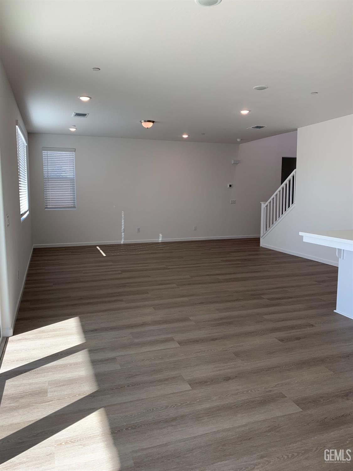 Undisclosed Address Bakersfield, CA 93314 - Photo 2 of 14 an empty room with wooden floor