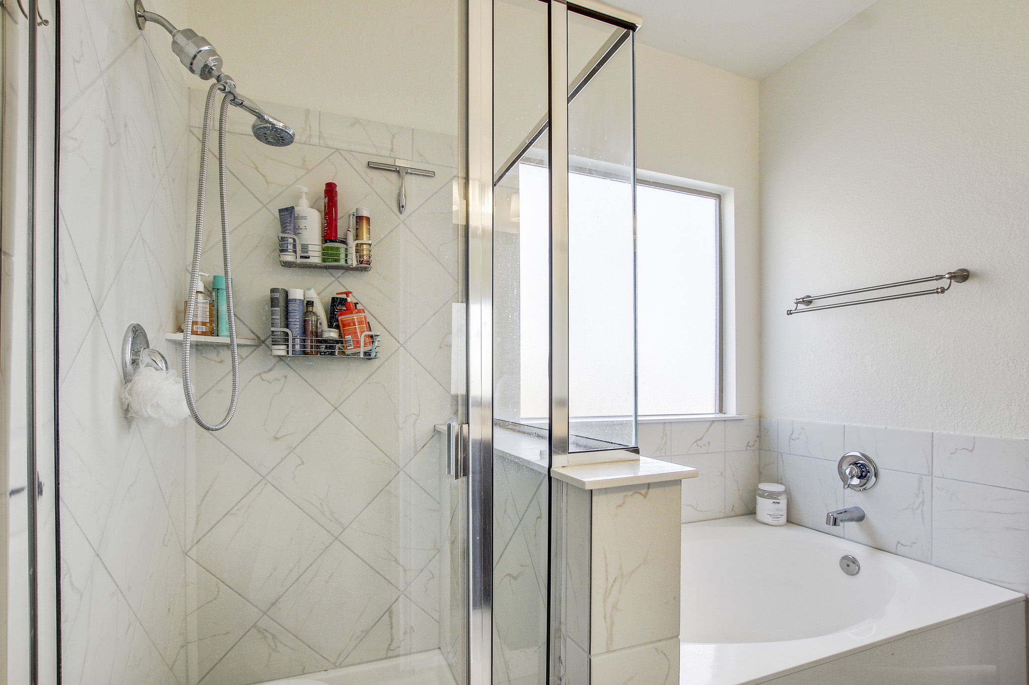 205 Travers Stake Trail Elgin, TX 78621 - Photo 16 of 28 Full bathroom featuring a stall shower, a garden tub, and healthy amount of natural light