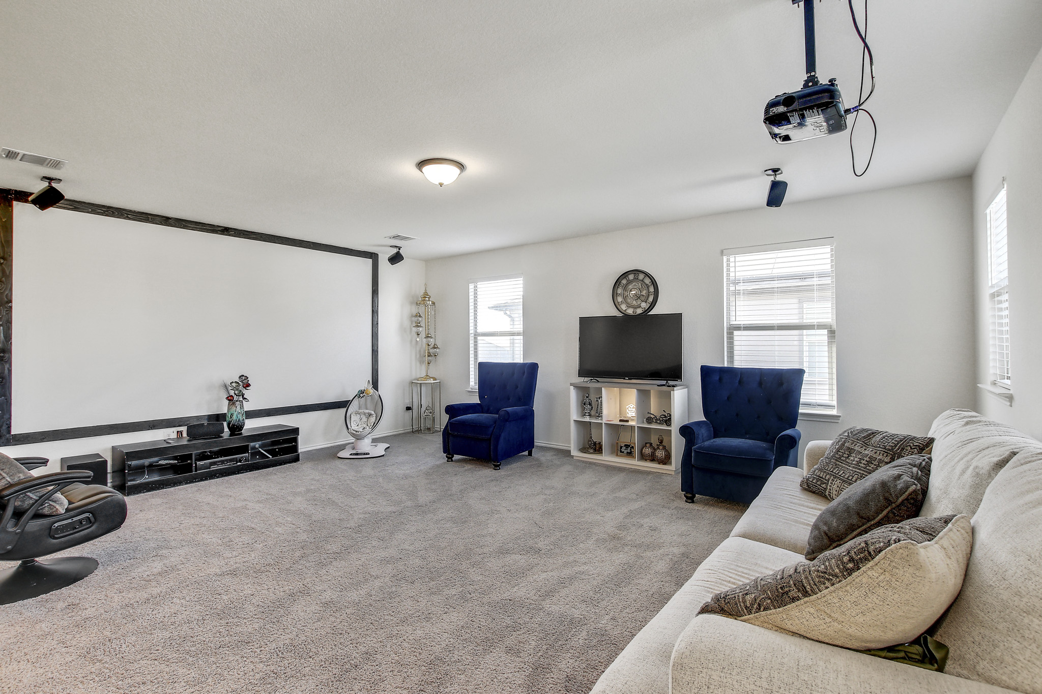 205 Travers Stake Trail Elgin, TX 78621 - Photo 19 of 28 Home theater room featuring carpet flooring and baseboards