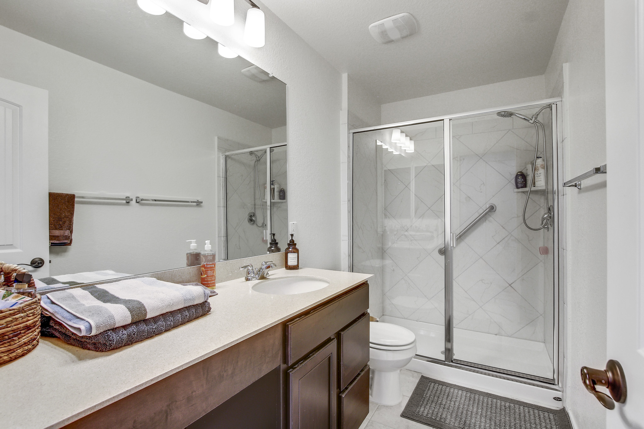 205 Travers Stake Trail Elgin, TX 78621 - Photo 22 of 28 Full bathroom featuring vanity and a stall shower