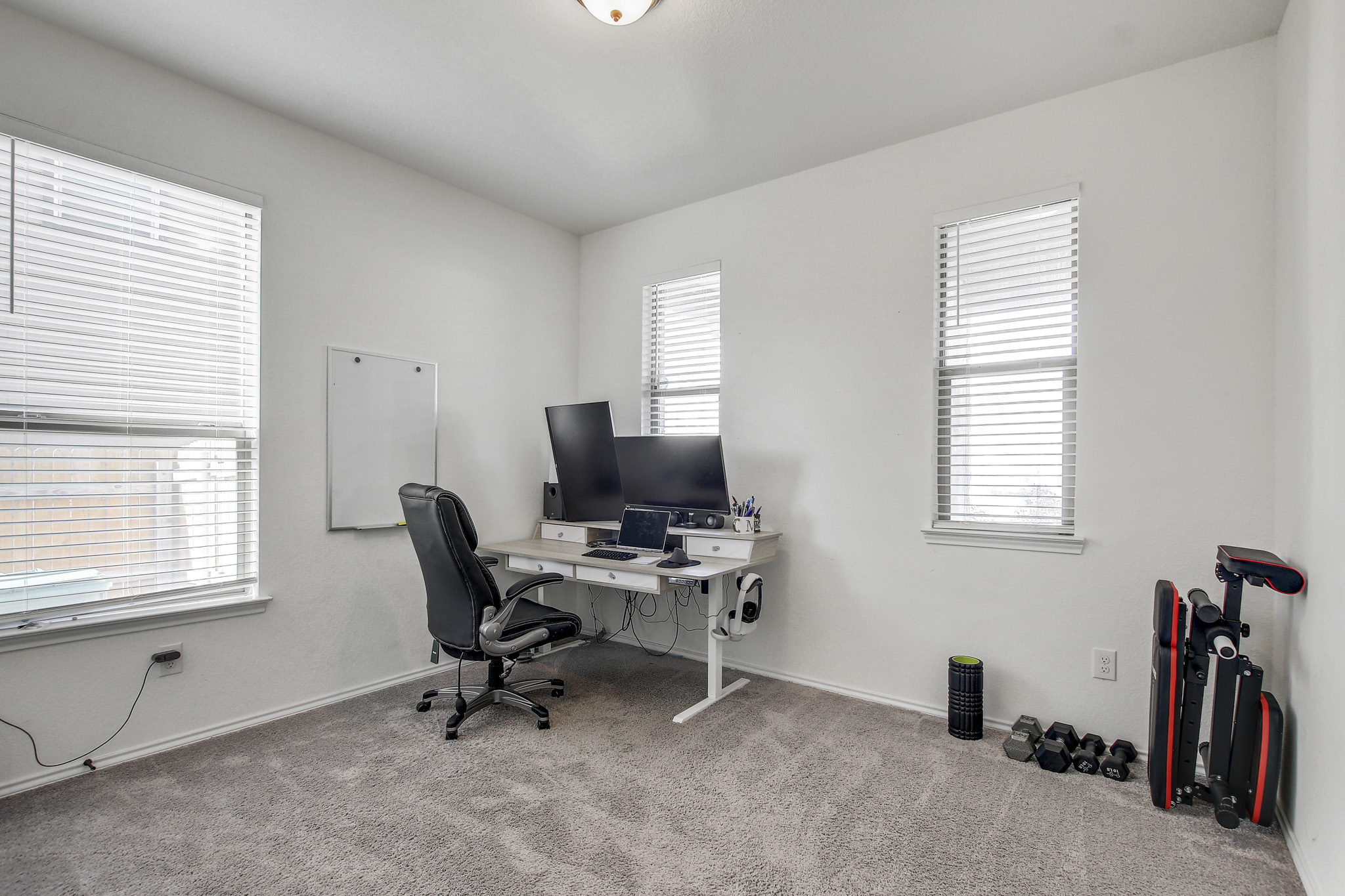 205 Travers Stake Trail Elgin, TX 78621 - Photo 23 of 28 Office area featuring light carpet and baseboards