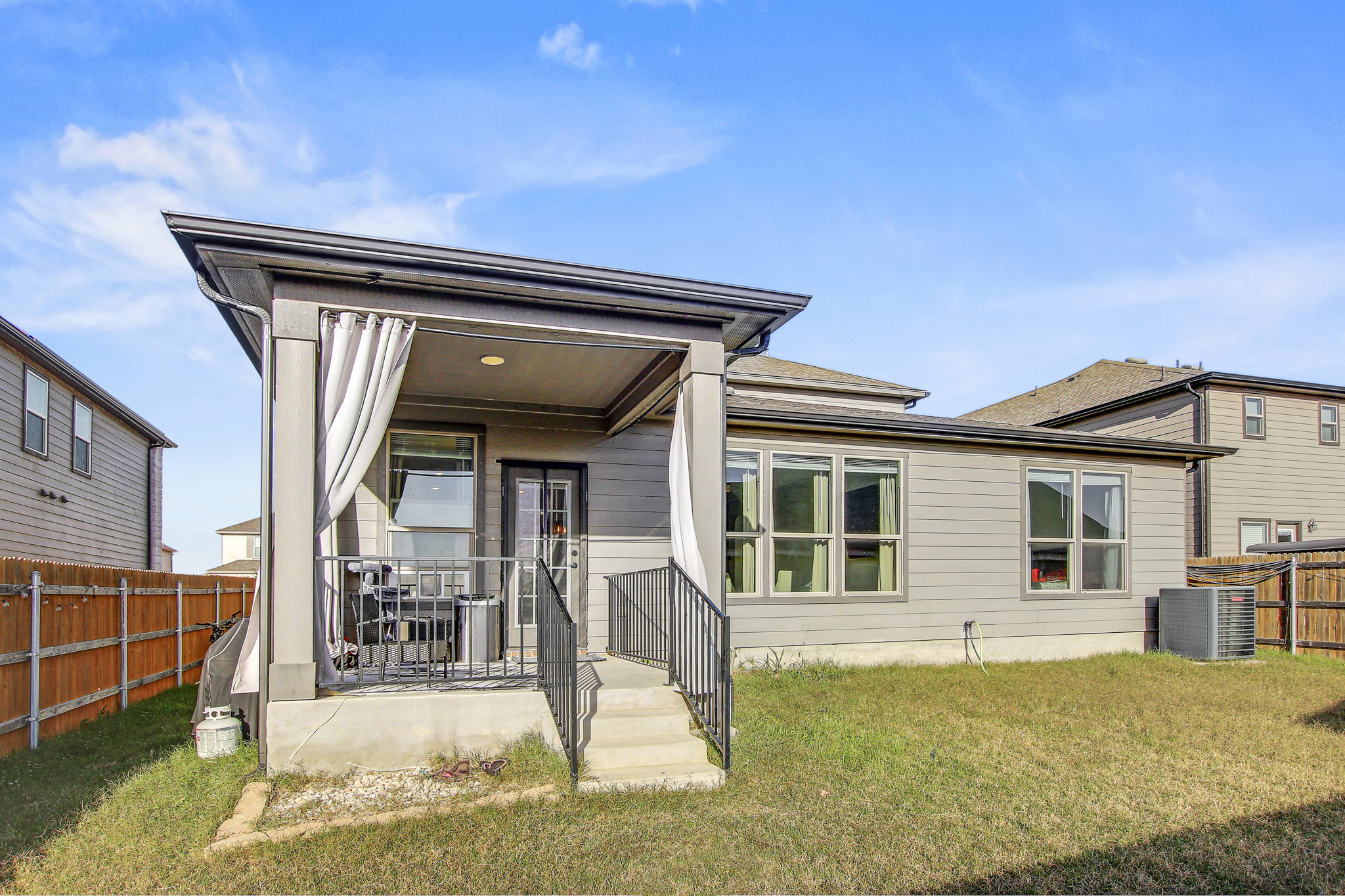 205 Travers Stake Trail Elgin, TX 78621 - Photo 27 of 28 Back of property featuring a fenced backyard