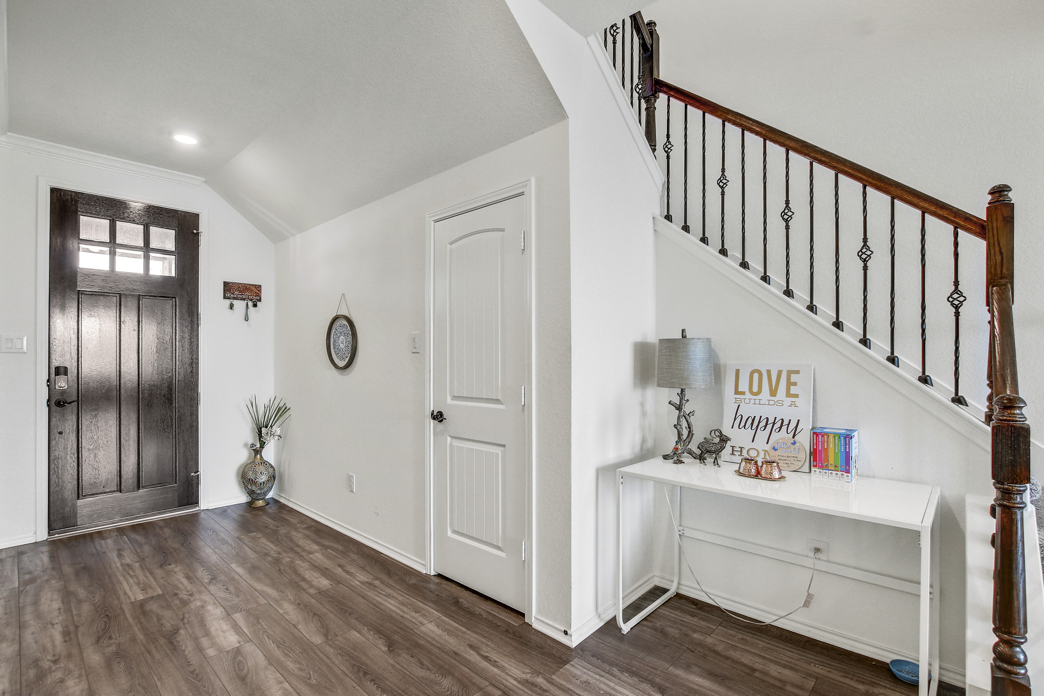 205 Travers Stake Trail Elgin, TX 78621 - Photo 5 of 28 Entrance foyer featuring dark wood-type flooring, vaulted ceiling, and recessed lighting