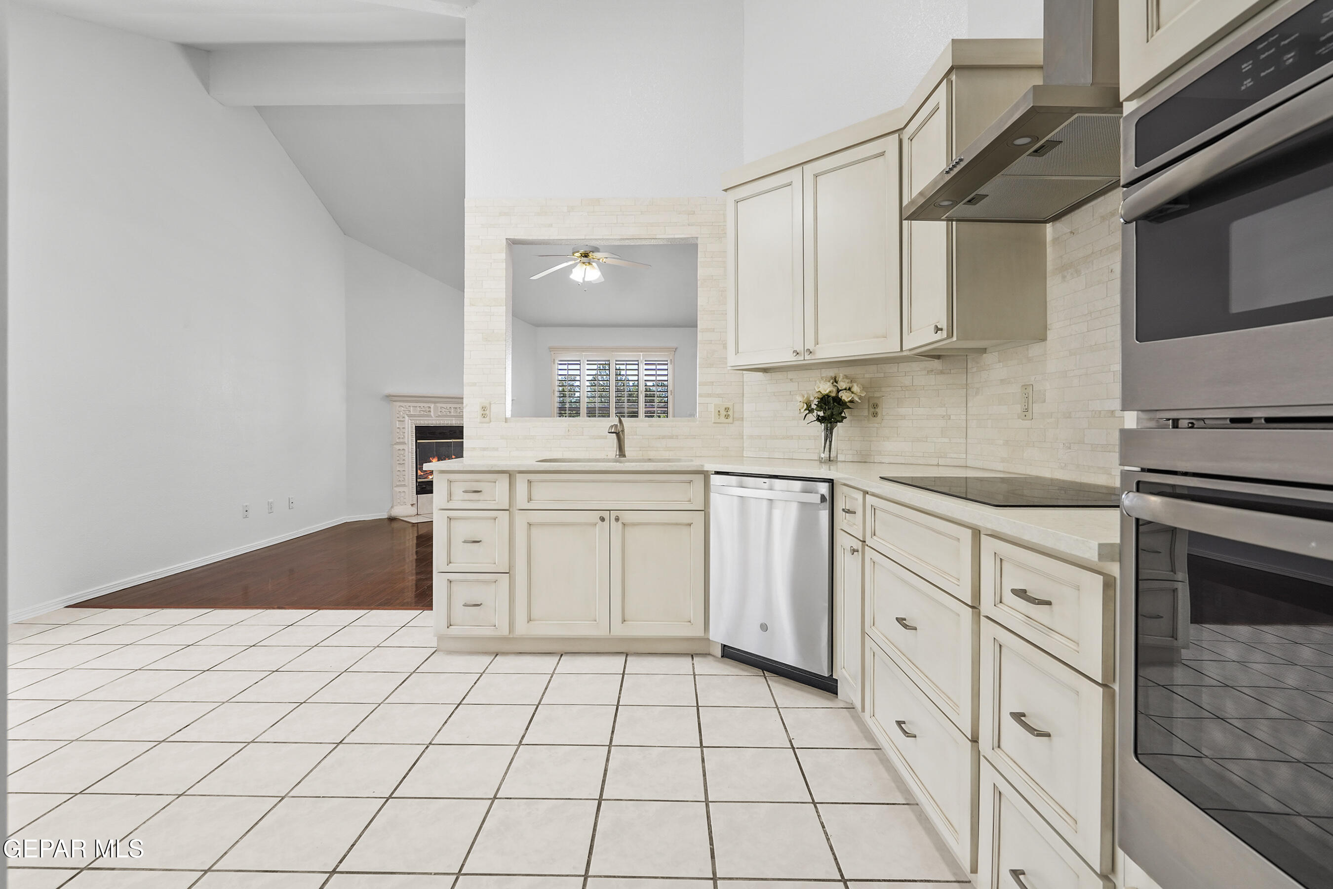 660 Rosinante Road El Paso, TX 79922 - Photo 11 of 43 a kitchen with white cabinets and appliances
