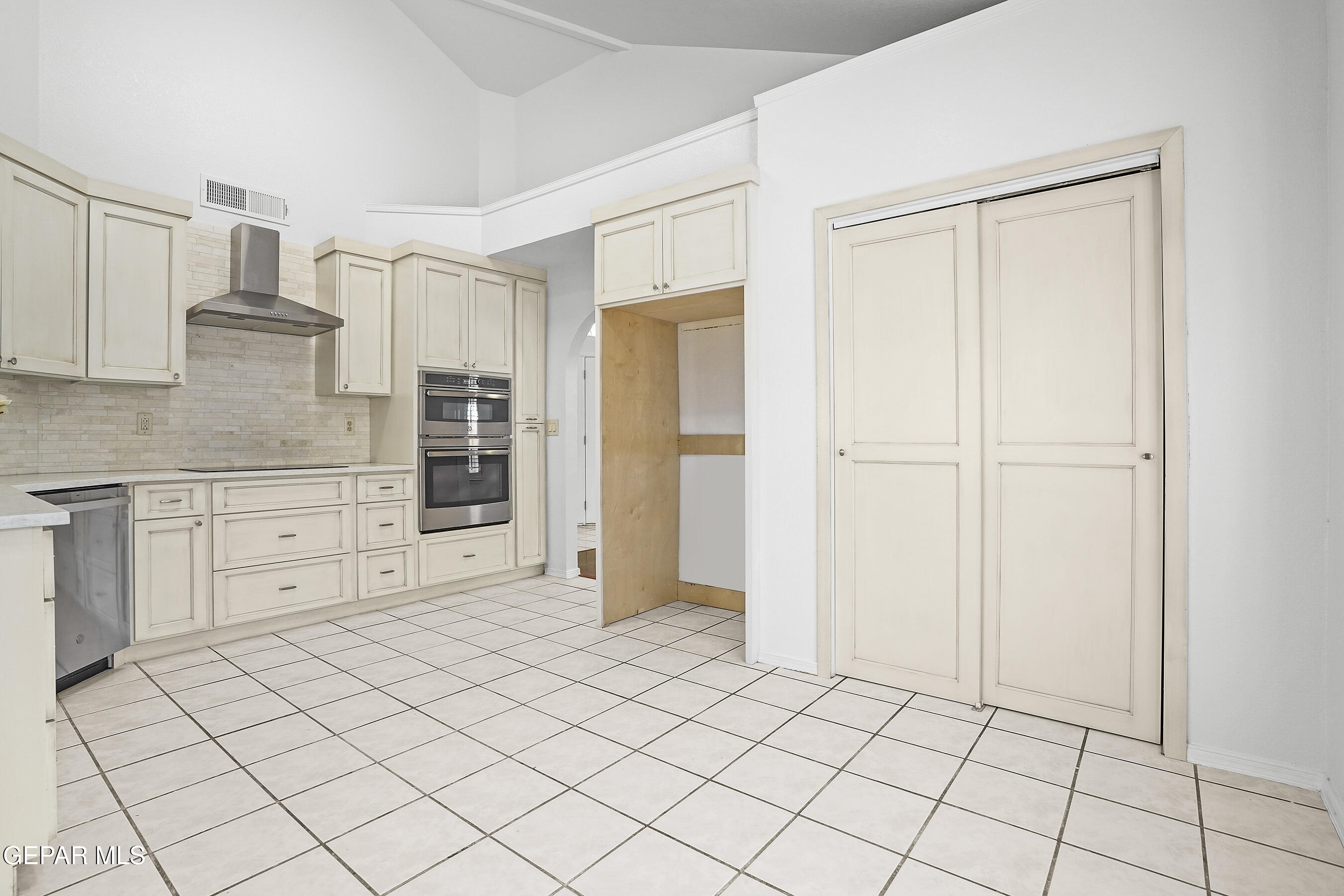 660 Rosinante Road El Paso, TX 79922 - Photo 12 of 43 a view of a kitchen with white cabinets
