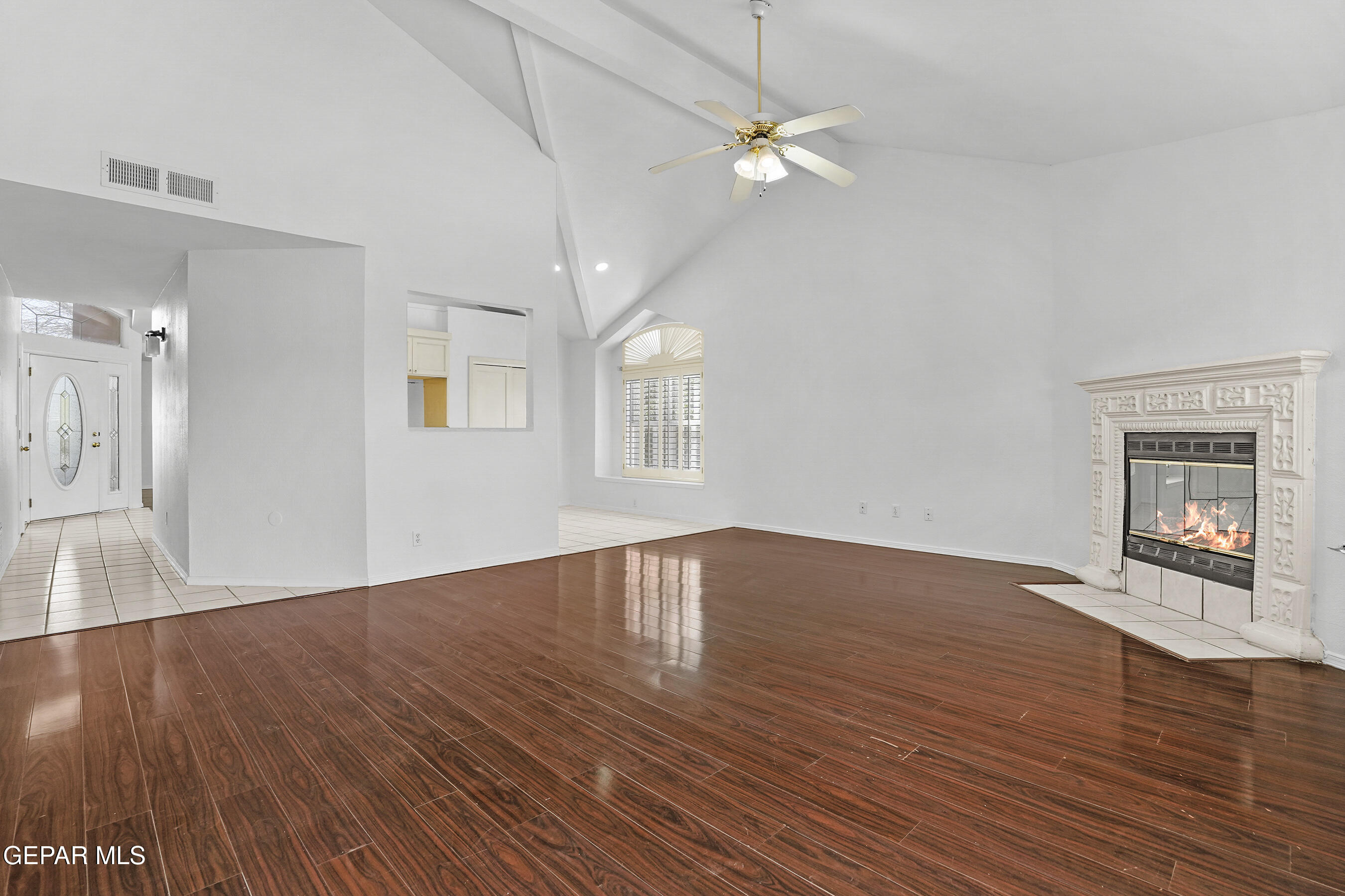 660 Rosinante Road El Paso, TX 79922 - Photo 15 of 43 a view of an empty room with wooden floor and a window