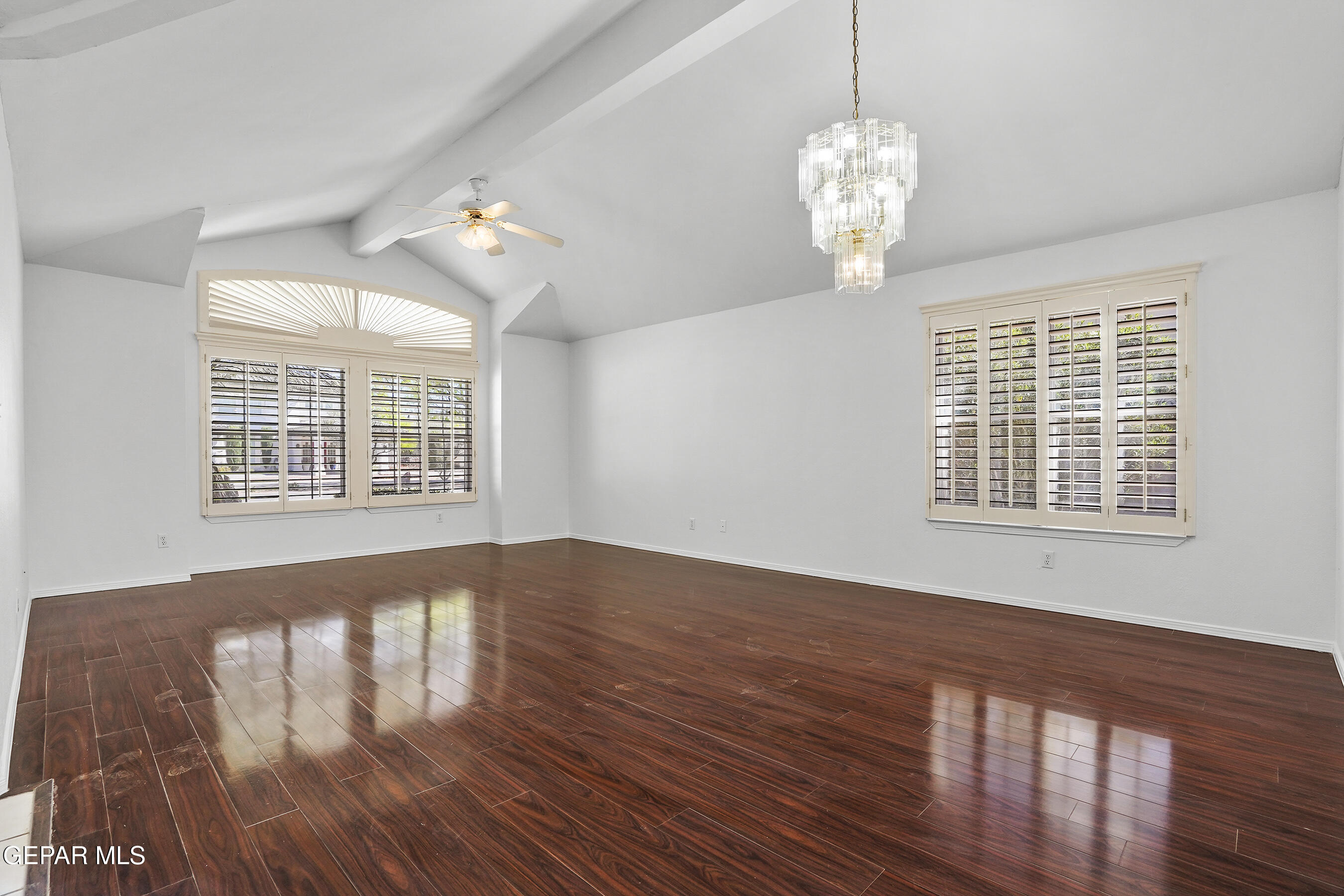 660 Rosinante Road El Paso, TX 79922 - Photo 19 of 43 a view of an empty room with wooden floor and a window