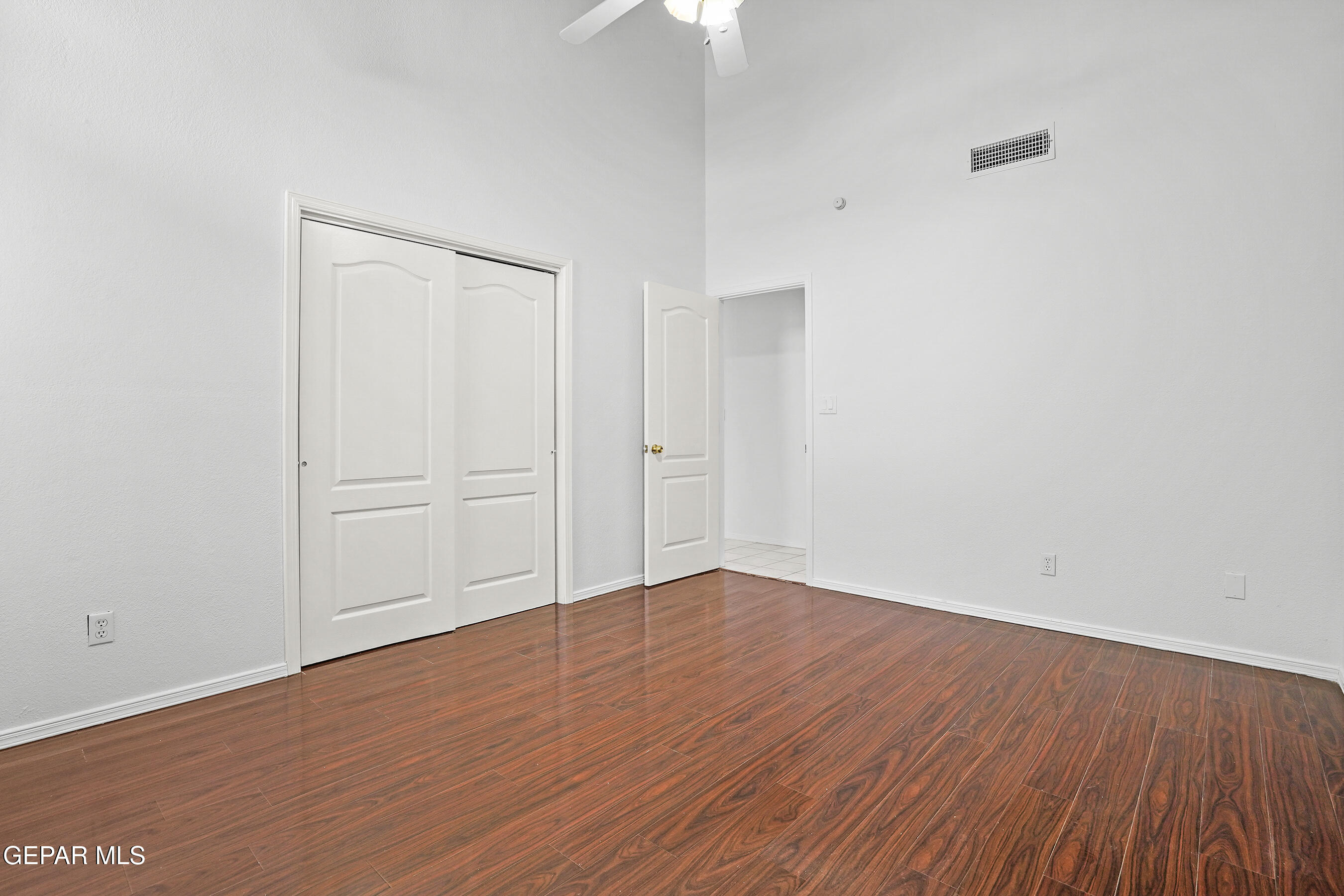660 Rosinante Road El Paso, TX 79922 - Photo 21 of 43 a view of an empty room with wooden floor