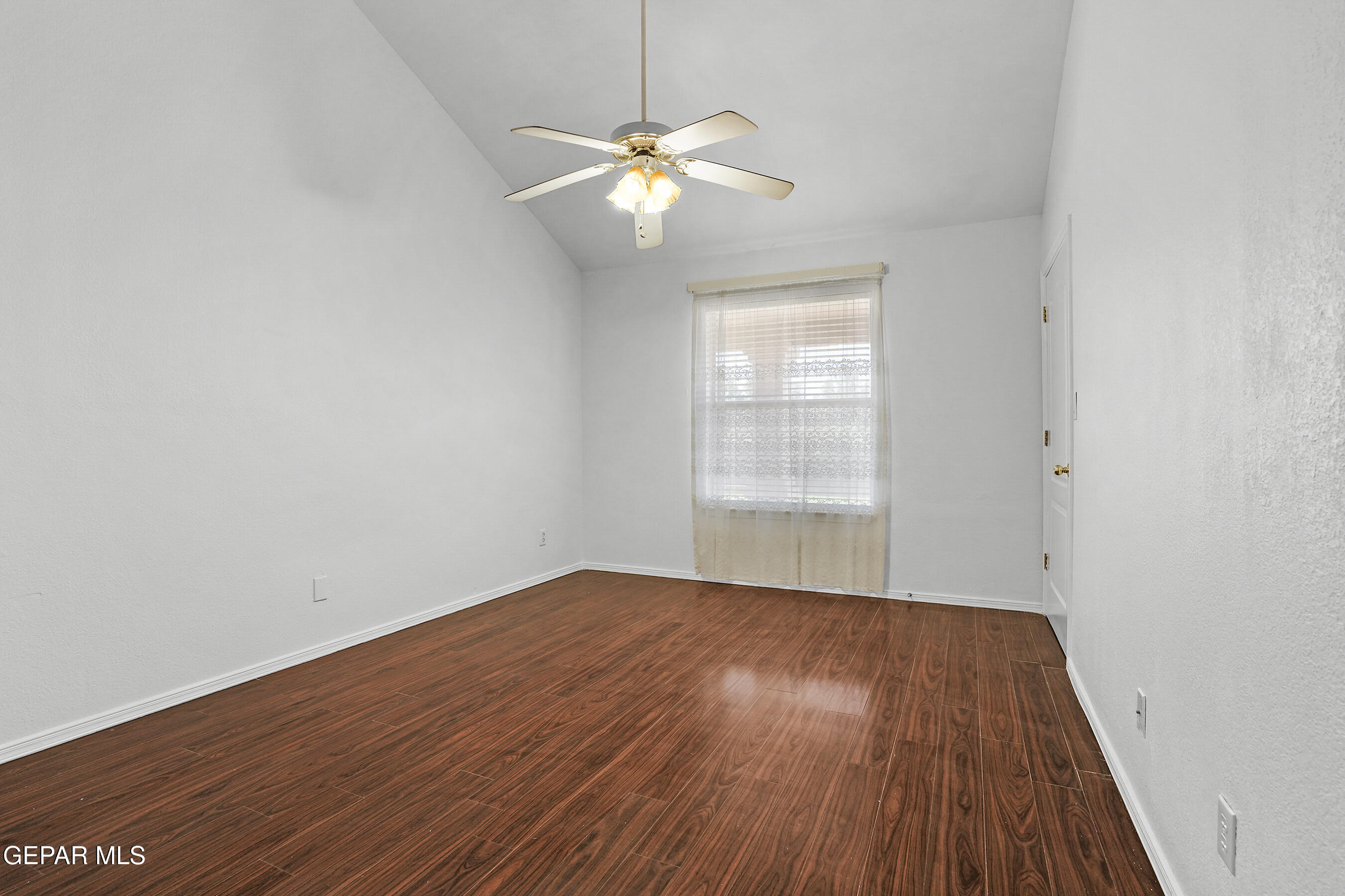 660 Rosinante Road El Paso, TX 79922 - Photo 22 of 43 wooden floor in an empty room with a window