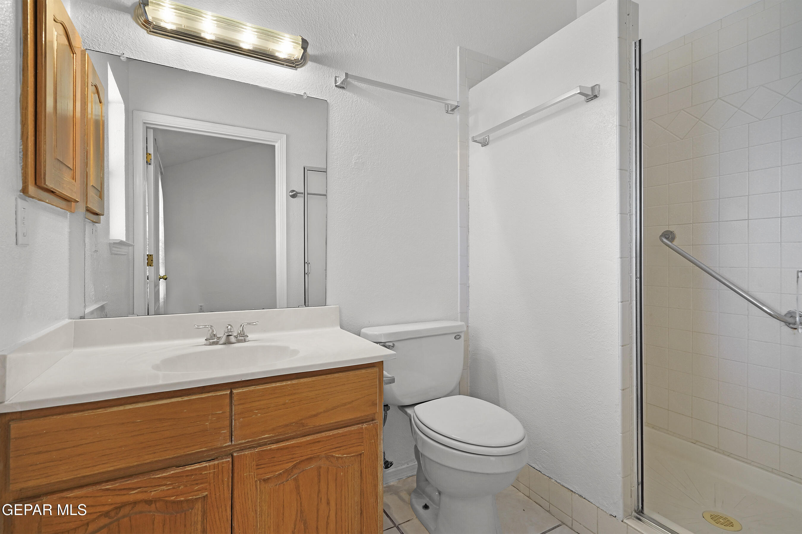 660 Rosinante Road El Paso, TX 79922 - Photo 24 of 43 a bathroom with a sink a toilet and shower