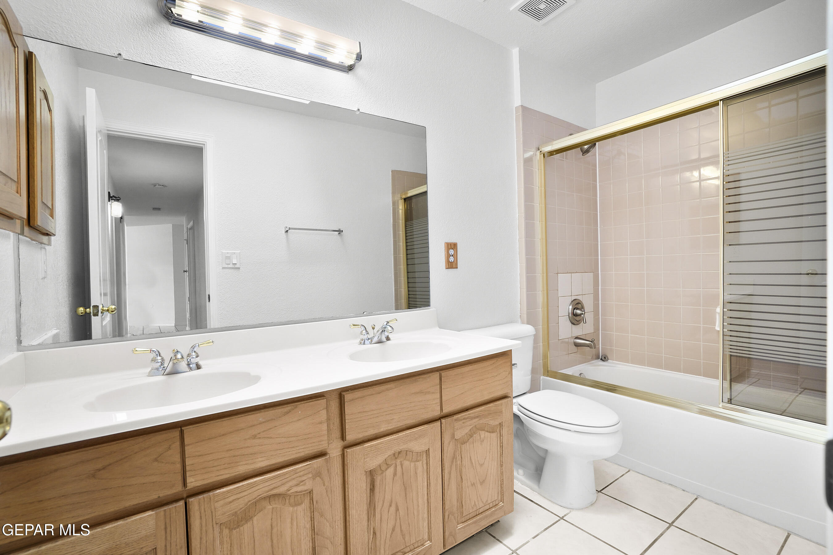 660 Rosinante Road El Paso, TX 79922 - Photo 25 of 43 a bathroom with a sink toilet and shower