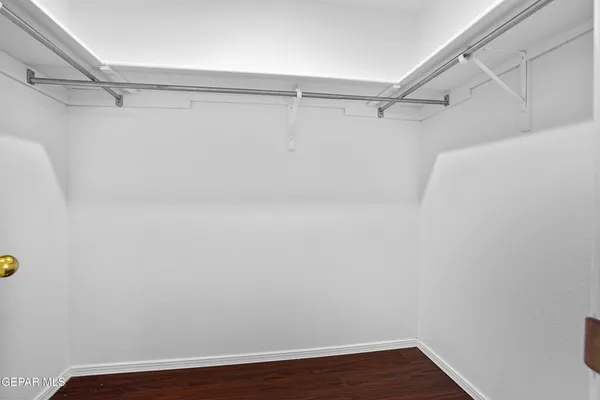 a view of a hallway with white walls