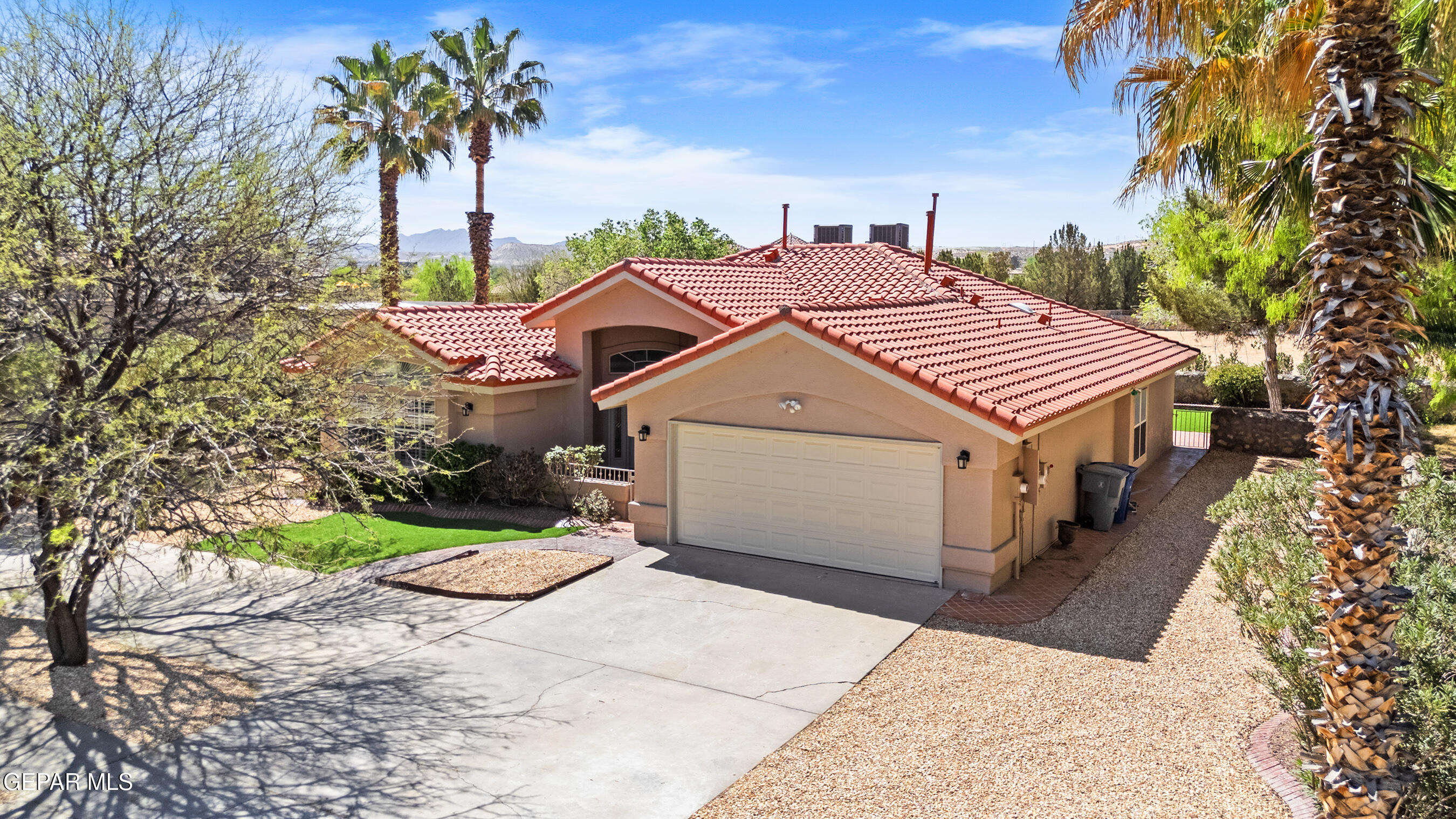 660 Rosinante Road El Paso, TX 79922 - Photo 3 of 43 a aerial view of a house with a yard and potted plants