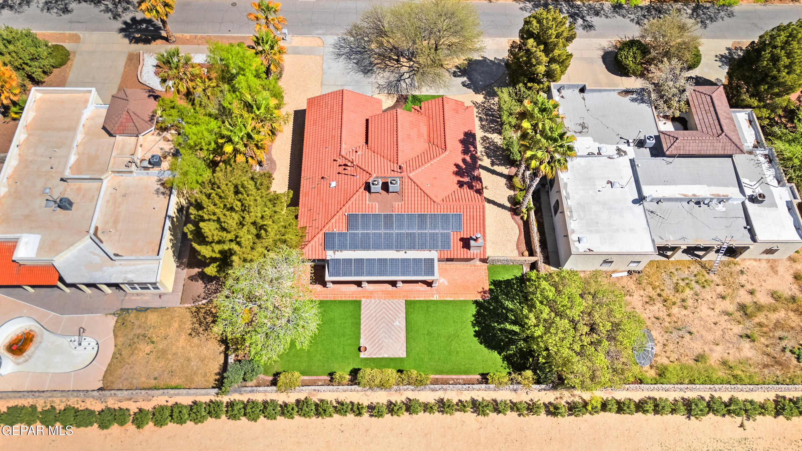660 Rosinante Road El Paso, TX 79922 - Photo 5 of 43 an aerial view of a house with a yard and garden