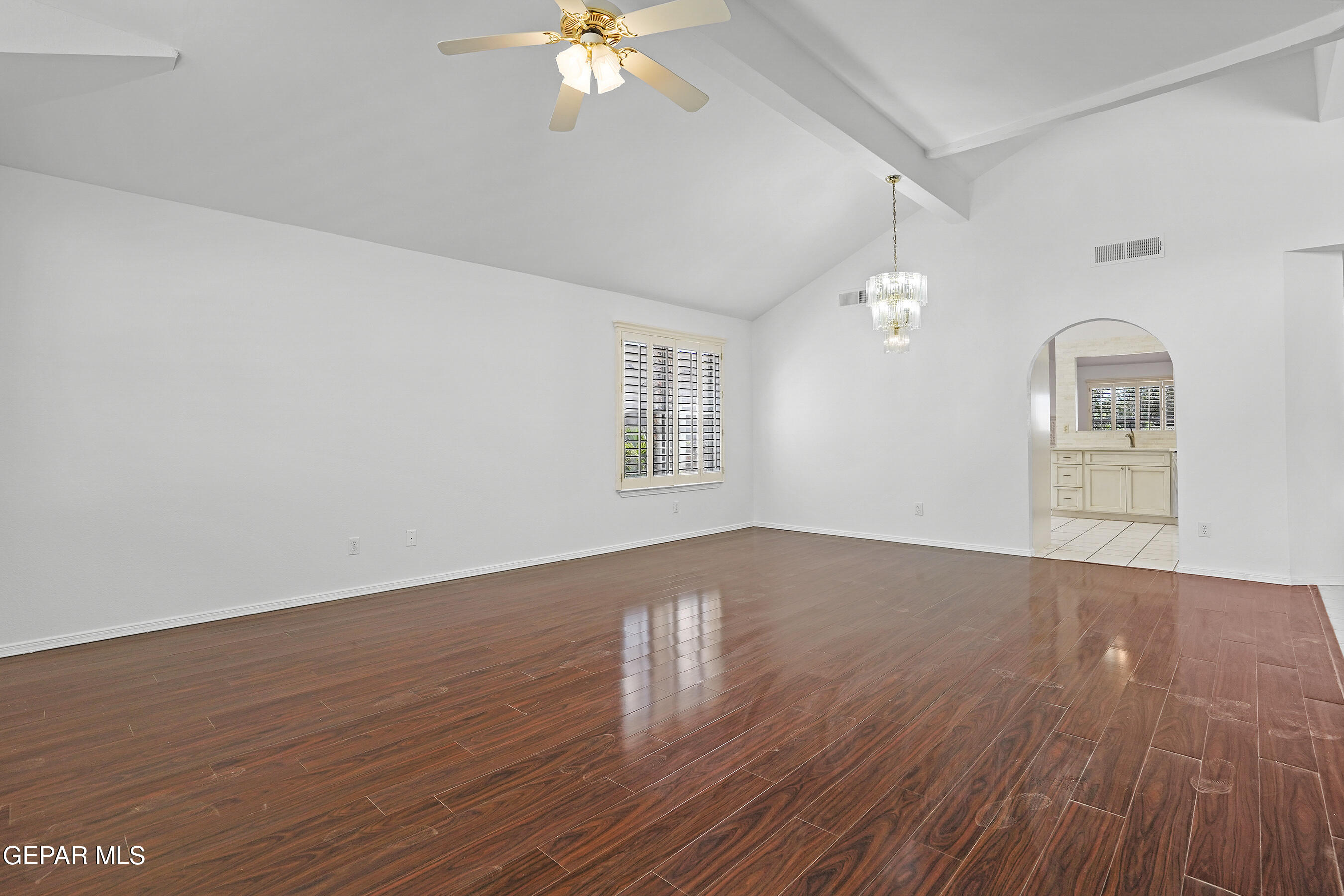 660 Rosinante Road El Paso, TX 79922 - Photo 9 of 43 wooden floor in an empty room with a window