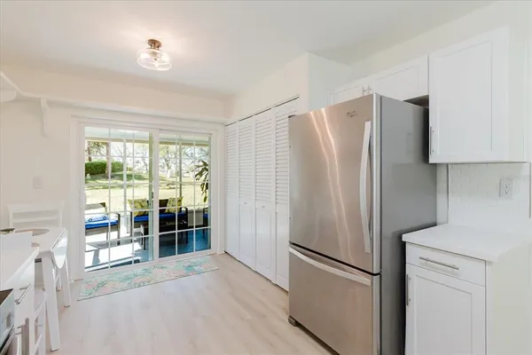 a kitchen with stainless steel appliances a refrigerator and a sink