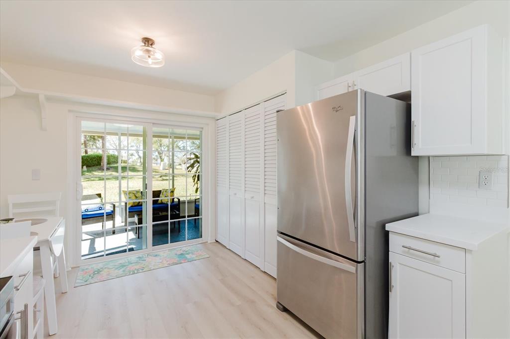 7807 Hardwick Drive, Unit 111 New Port Richey, FL 34653 - Photo 15 of 38 a kitchen with stainless steel appliances a refrigerator and a sink