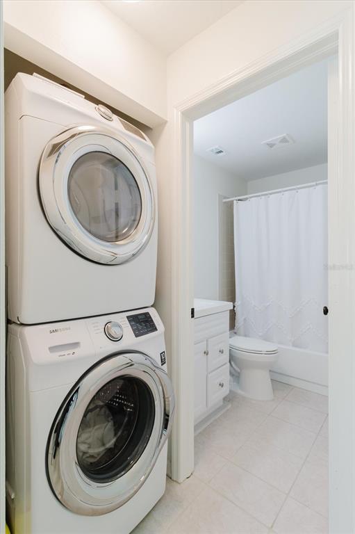 7807 Hardwick Drive, Unit 111 New Port Richey, FL 34653 - Photo 30 of 38 a utility room with dryer and washer