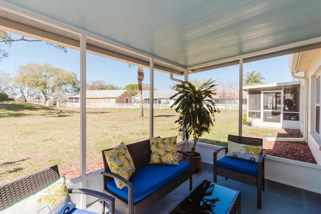 7807 Hardwick Drive, Unit 111 New Port Richey, FL 34653 - Photo 32 of 38 a living room with furniture and a large window