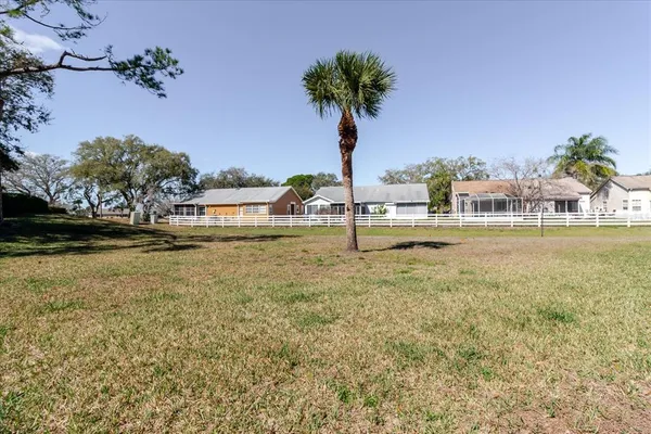 a view of a swimming pool with a lake view