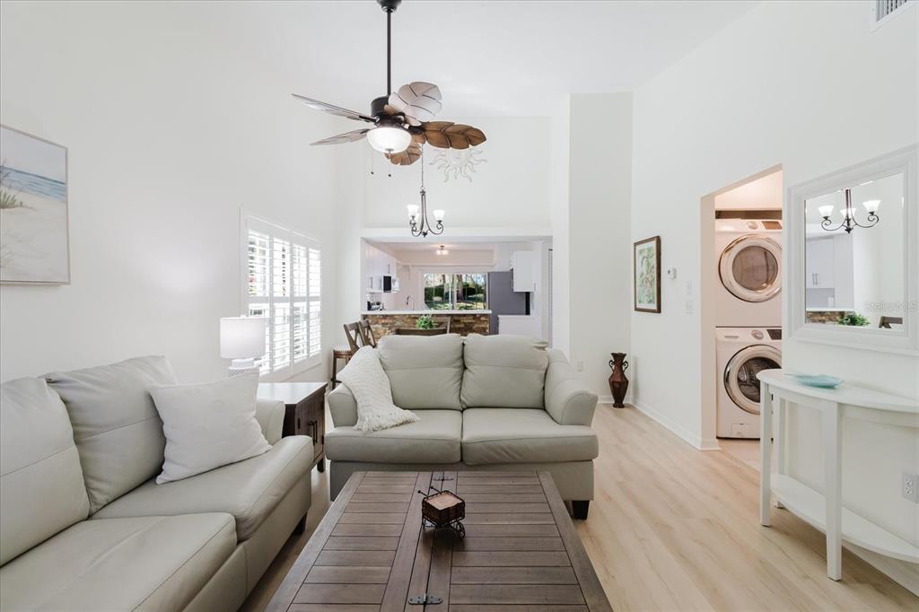 7807 Hardwick Drive, Unit 111 New Port Richey, FL 34653 - Photo 5 of 38 a living room with furniture a rug and white walls