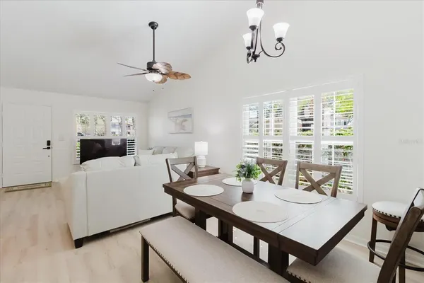 a view of a dining room with furniture window and wooden floor