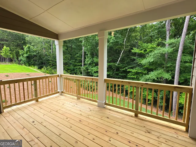 a view of balcony with wooden floor