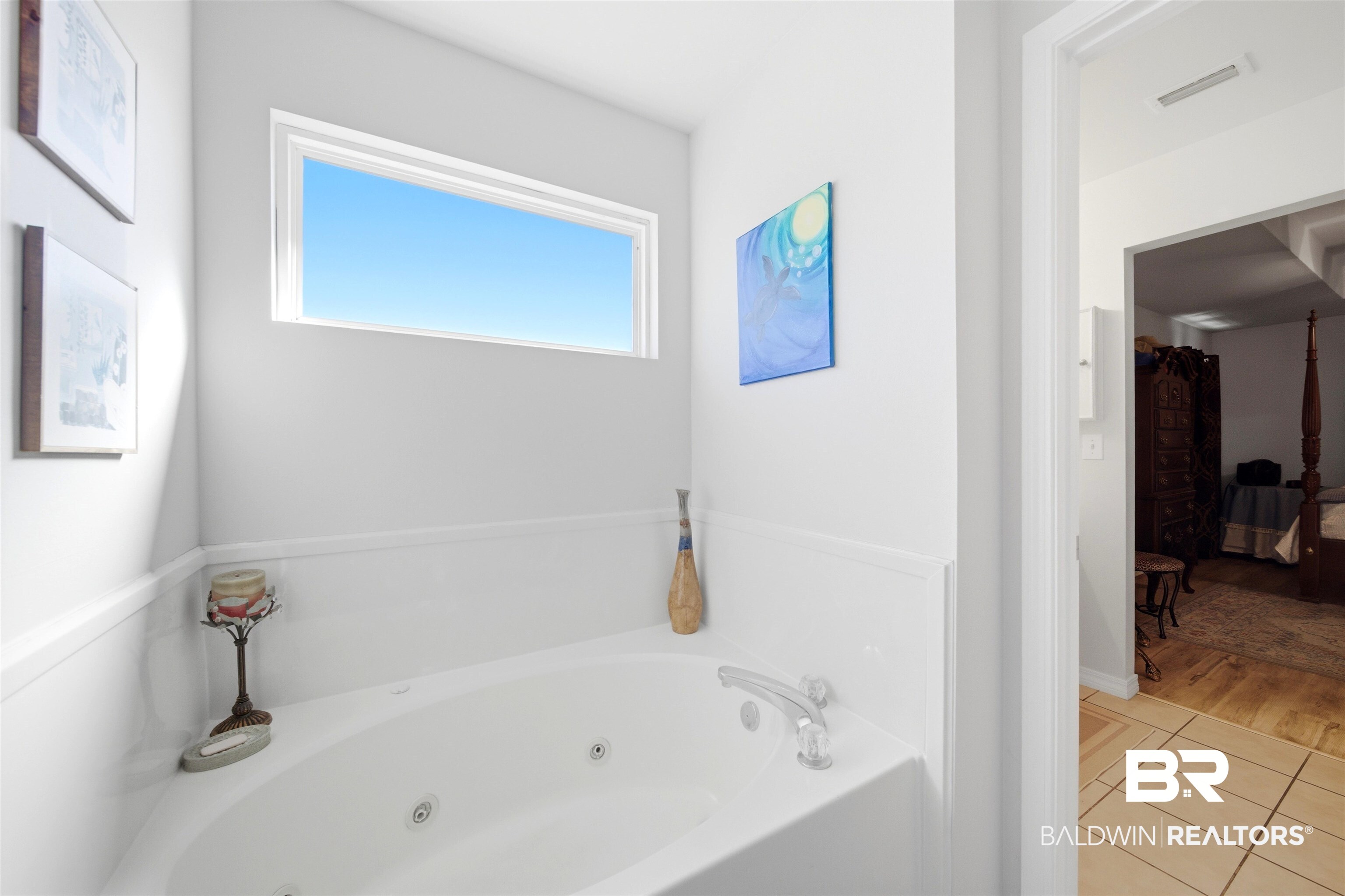 1901 Colorado Court Foley, AL 36535 - Photo 12 of 23 Bathroom featuring tile patterned flooring, a tub with jets, and connected bathroom