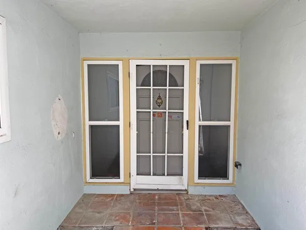 a view of a house with a street