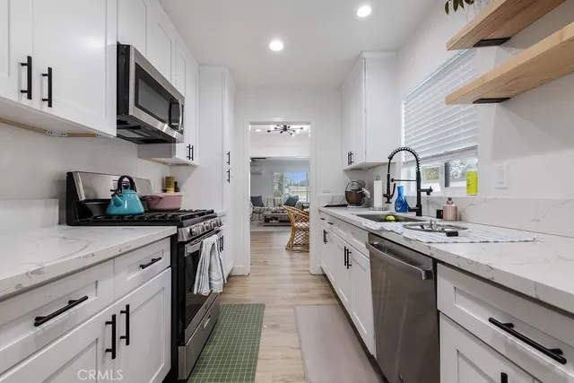 a bathroom with a double vanity sink a mirror and a shower