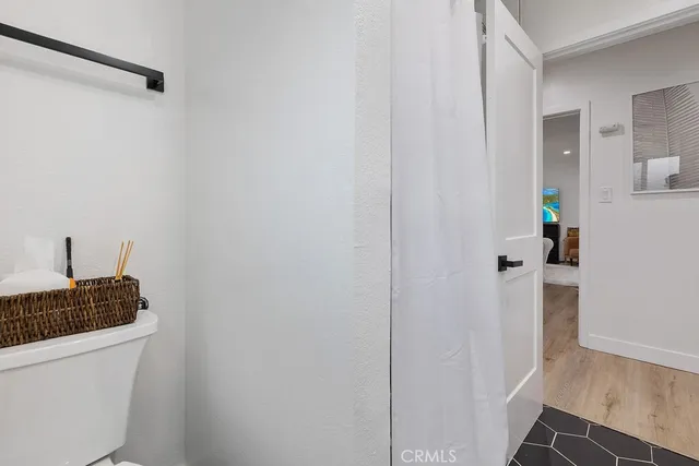 a bedroom with a bed and a chair