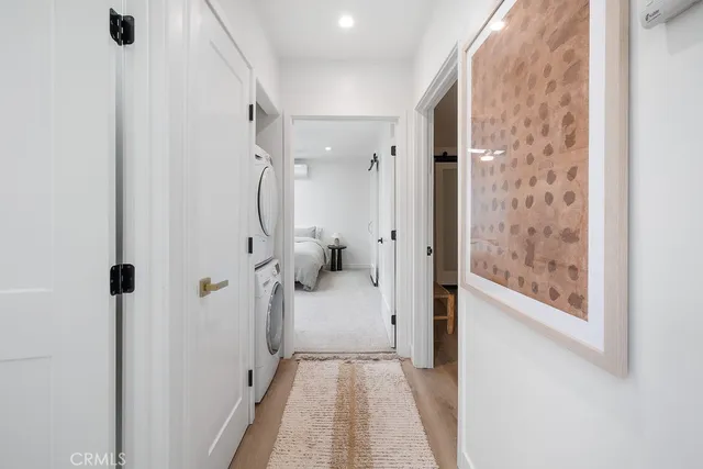 a kitchen with cabinets stainless steel appliances and sink