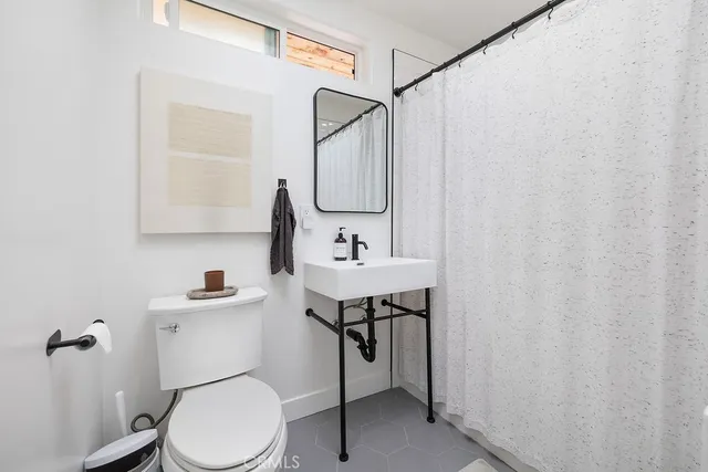 a stove top oven sitting inside of a kitchen