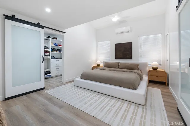 a view of a workspace with furniture and a book shelf